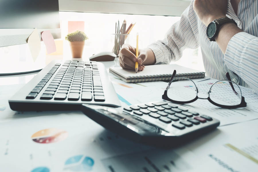 Bookkeeping Services - Accountant Looking Over the Books for Accuracy